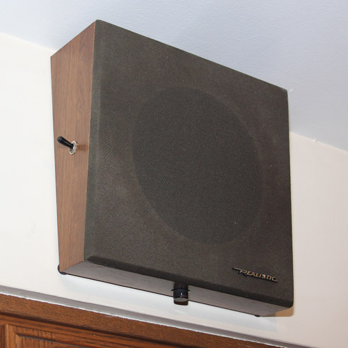 Speaker mounted on wall